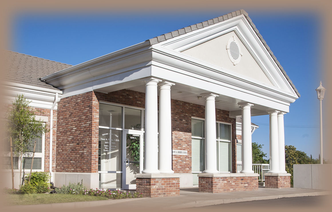 Background picture of Dr. Boren's Implant and Family Dentistry office front entrance. State of the art facility